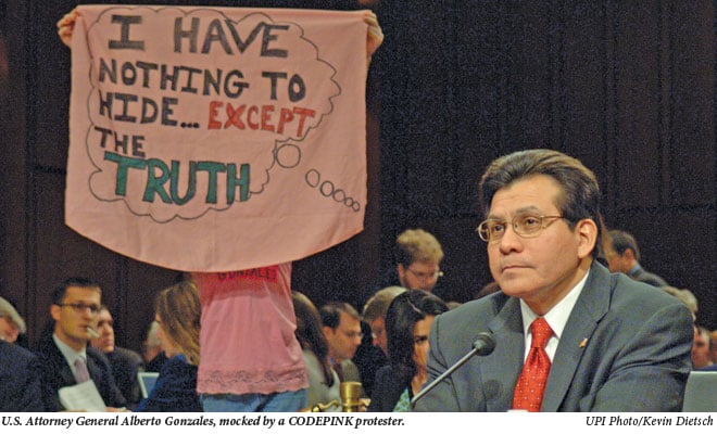 Alberto Gonzalez mocked by a CODEPINK protester.
