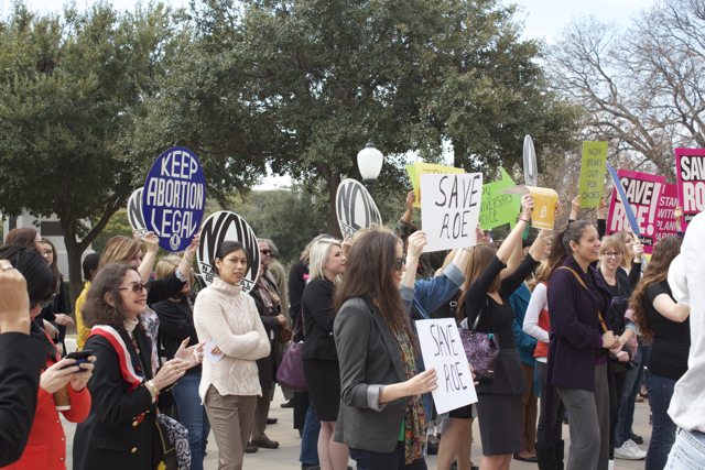 Pro-choice activists rally at the Capitol on the 40th anniversary of Roe v. Wade
