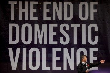 Dallas Mayor Mike Rawlings speaks at the anti-domestic violence rally Saturday.