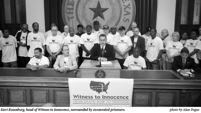 Kurt Rosenberg surrounded by exonerated prisoners