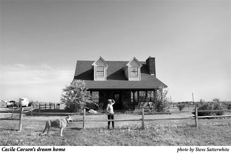 photo of Cecile Carson in front of her dream home by Steve Satterwhite
