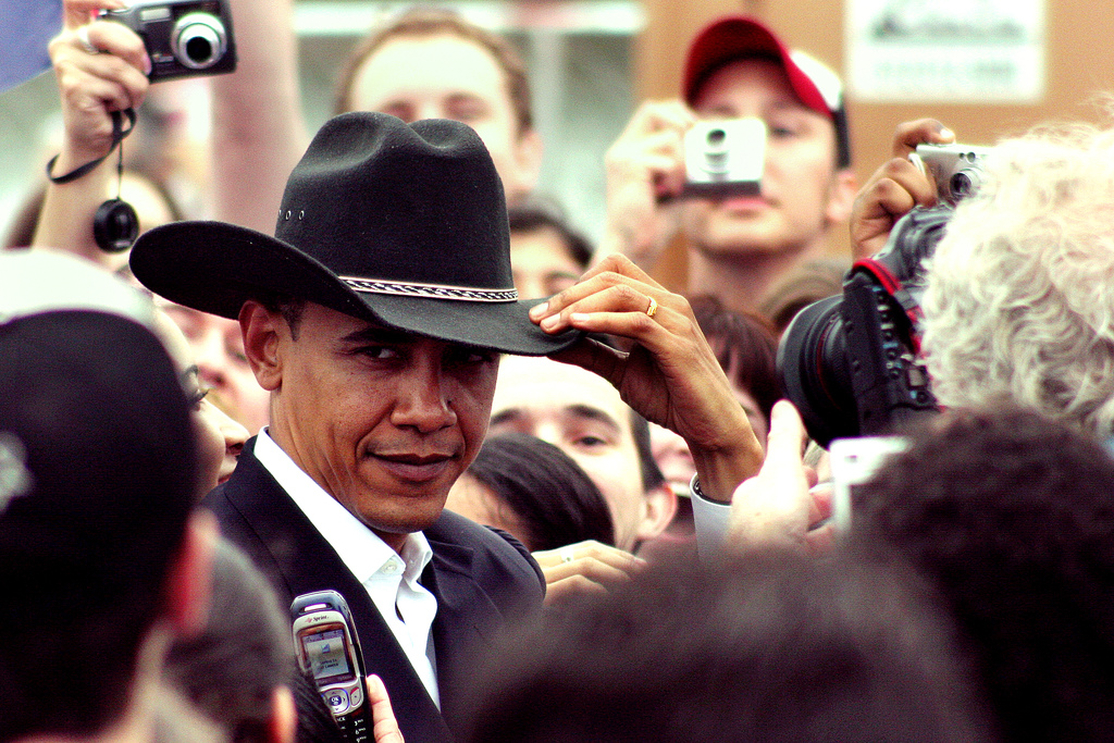 Barack Obama wearing a cowboy hat.