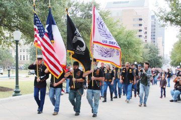 Bikers march to the Capitol steps Monday morning.