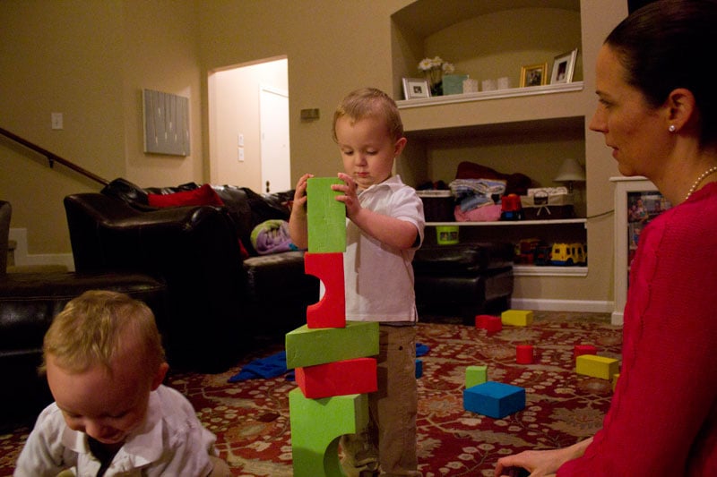 Jude Dimmick, center, plays with his twin brother, Henry, and mother, Ann, in their Austin home.