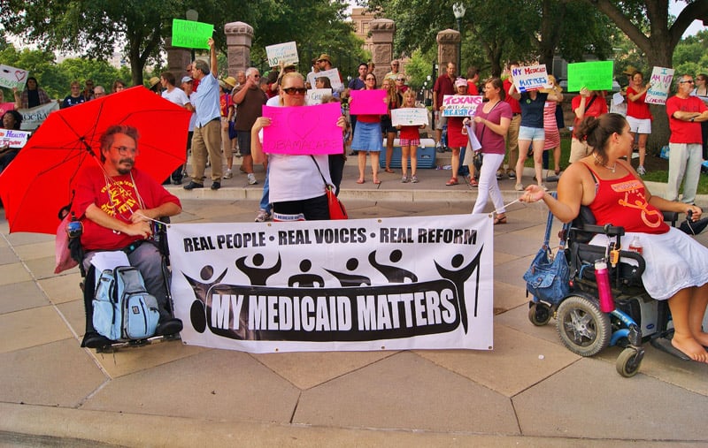 Members of the Texas Chapter of ADAPT celebrate the United States Supreme Court’s upholding of the Affordable Care Act, also known as Obamacare, in front of the Texas Capitol.