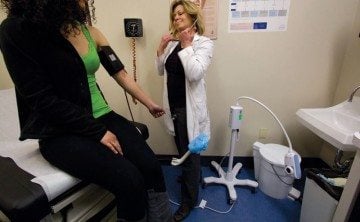 A patient gets her blood pressure checked at the Waco Planned Parenthood.