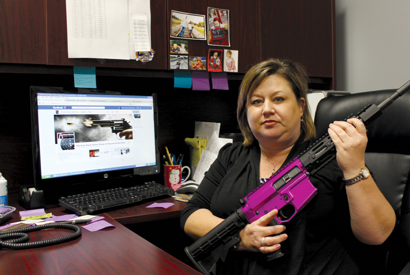 Brandy Liss runs The Arms Room, a gun store and shooting range in League City. She declines the title “gun enthusiast,” but owns several weapons, including this colorful AR-15.