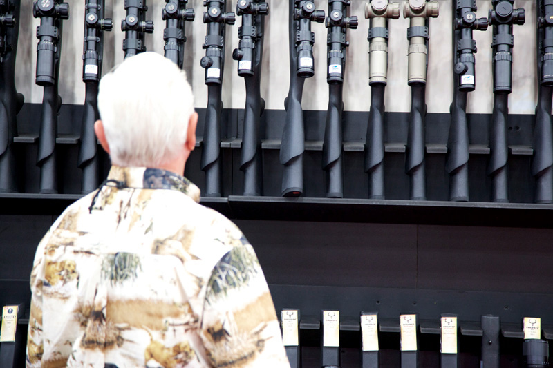 An NRA Annual Meetings and Exhibits attendee peruses a wall of guns at Houston’s George R. Brown Convention Center on May 3.