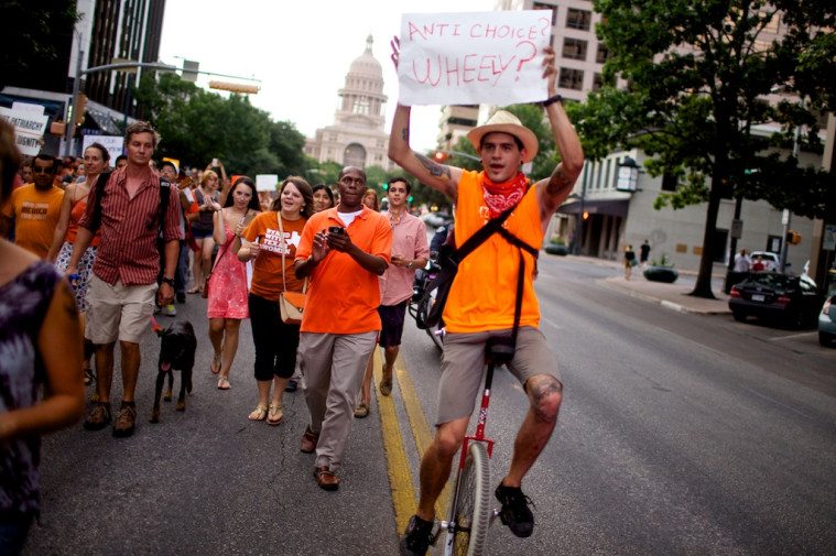 Pro-choice activists march down Congress Avenue.