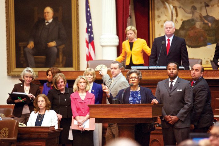 Rep. Senfronia Thompson displays a hanger during a contentious abortion debate on the House floor in early July.