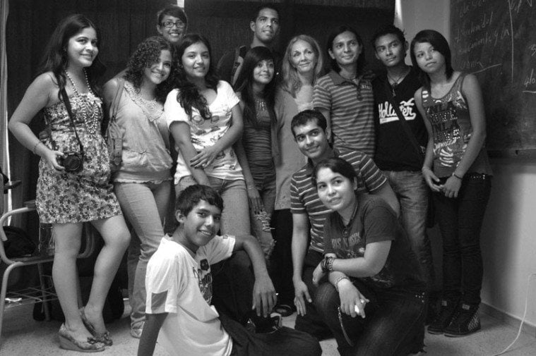 Student participants in DeCesare's 2011 photography workshop pose together following their public presentation at the Central American University (UCA).