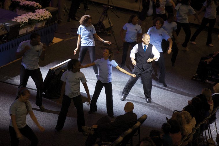 Stepping up: Mike Miles shows off his dance moves with Dallas students.