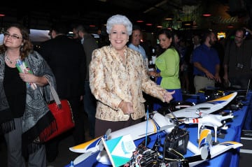 Corpus Christi Mayor Nelda Martinez inspects the drone display at a Jan. 13 event in Corpus Christi celebrating the FAA's designation of Texas as one of six states nationwide to perform tests toward the 2015 inauguration of commercial drone flight.