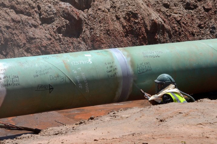 A TransCanada employee works on a section of the Keystone XL pipeline near Winnsboro last year.