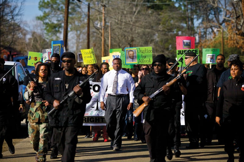 Quanell X leads a march past Hemphill’s town square, calling for justice for Alfred Wright.