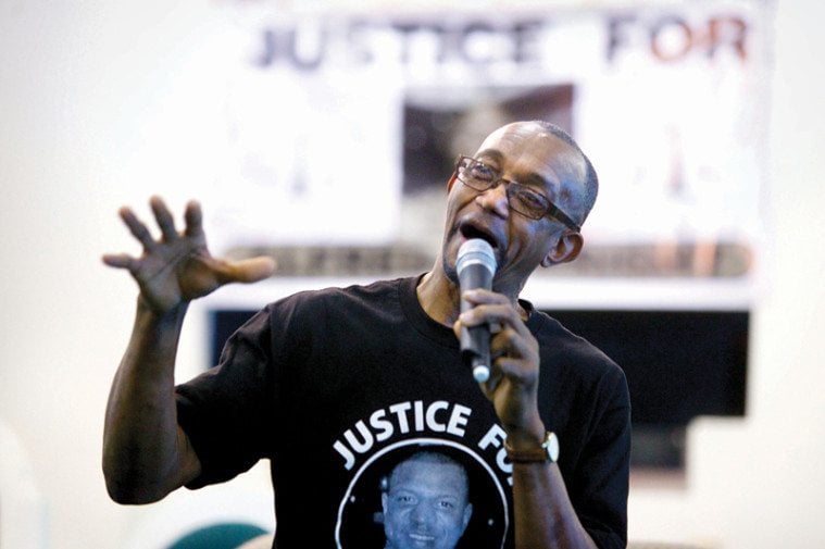 Douglas Wright speaks at the memorial for his son, Alfred.