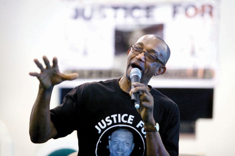 Douglas Wright speaks at the memorial for his son, Alfred. 