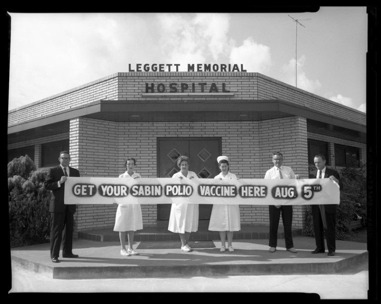 Vaccination campaigns all but eradicated troublesome diseases like polio and whooping cough. Leggett Memorial Hospital employees hold a banner announcing the arrival of the polio vaccine in Cleveland, Texas, 1962.