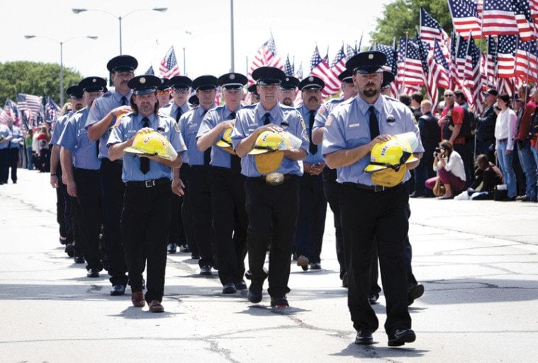Members of the West Volunteer Fire Department proceed to a memorial in Waco on April 25, 2013, for victims of the West explosion.