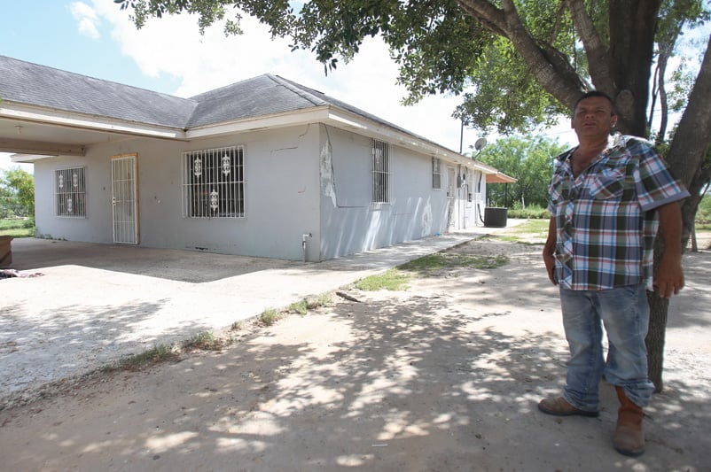 Joel Acosta stands outside the foreclosed Sullivan City home that he and his wife, Estela, no longer own.