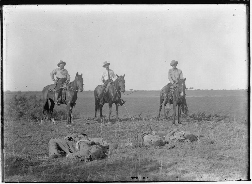 Texas Rangers pose on a South Texas ranch in 1915 after one of their notorious "bandit raids."