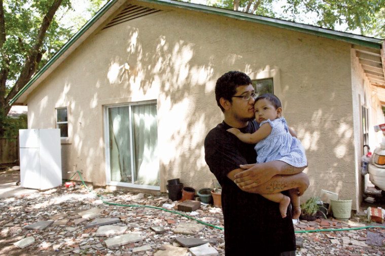 Everado Garcia with his niece, Camilla, at his home in Austin.