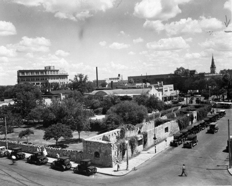 Alamo Plaza, with the long barracks building in foreground, photographed in 1936.