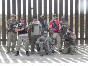 A group photo of militia members who have set up a camp near Brownsville.
