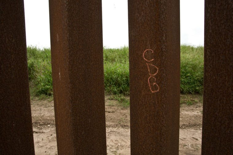 Graffiti on the border wall, which members of Camp Lonestar believe to be the initials for Cartel de Golfo.