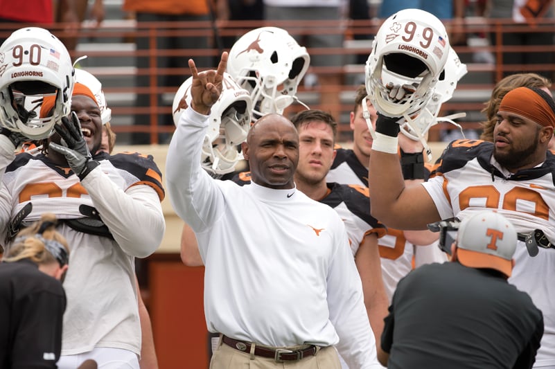 Charlie Strong and players after the annual Orange-White scrimmage.