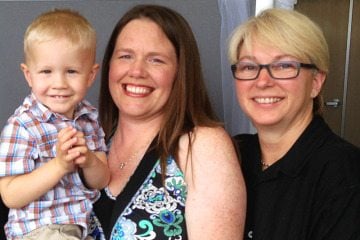 Aimee Wilson (center) and Connie Wilson (right) with their son Aidyn.