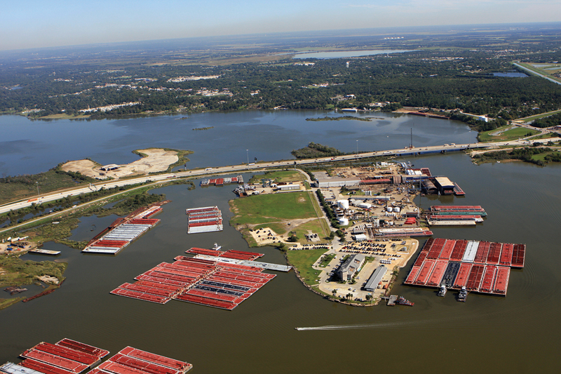 A portion of the San Jacinto River Waste Pits site, near the Interstate 10 bridge in Harris County, remains visible as the sandy area in the center left of this photograph.