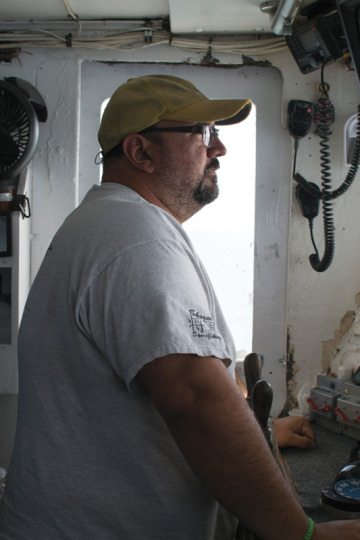 William “Bubba” Cochrane, captain of the Chelsea Ann, navigates back toward Galveston. Cochrane, once a skeptic, is now an avid supporter of the “individual fishing quota” system governing commercial snapper fishermen. 