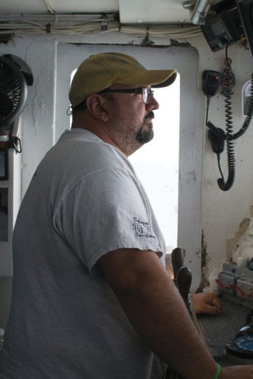 William “Bubba” Cochrane, captain of the Chelsea Ann, navigates back toward Galveston. Cochrane, once a skeptic, is now an avid supporter of the “individual fishing quota” system governing commercial snapper fishermen.