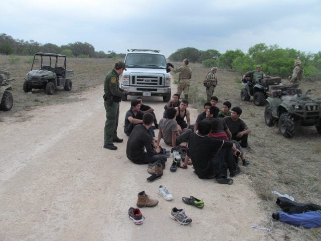 A Border Patrol agent arrives to take custody of a group of immigrants from Texas Border Volunteers.