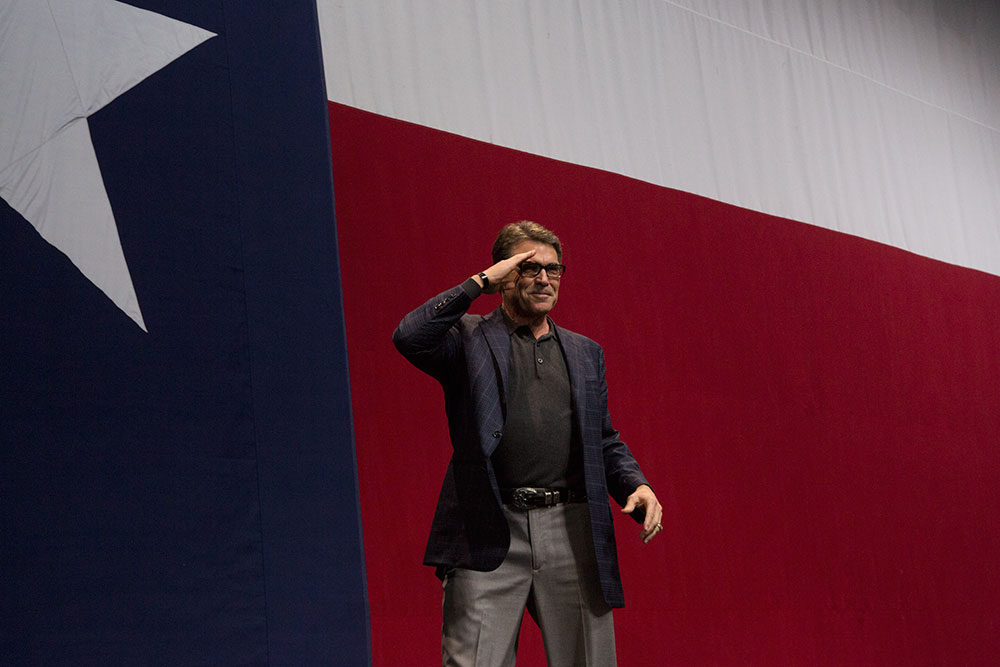 Perry salutes the crowd during Greg Abbott's victory party on election night, 2014.