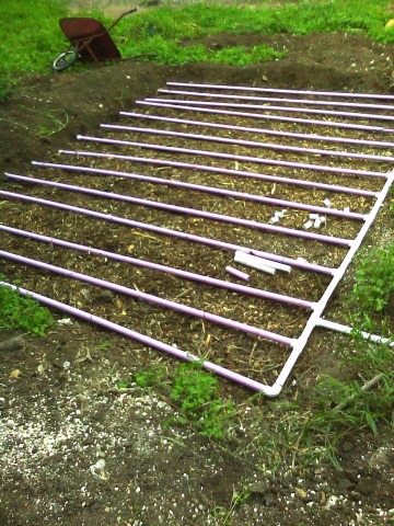Perforated PVC is buried beneath the surface to sub-irrigate a garden with graywater.