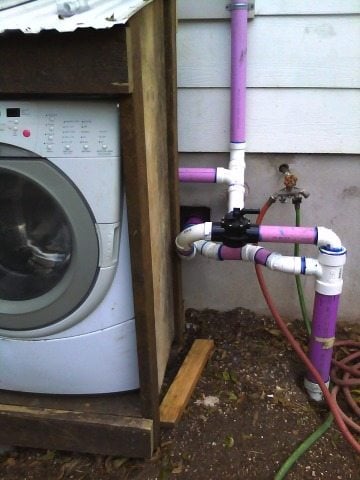 The home is replumbed to drain water from a sink, a bathtub and a washing machine to a holding tank outside.
