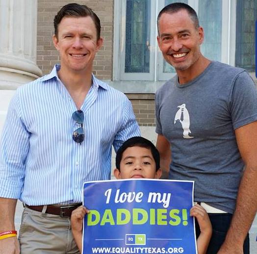 Andy Miller (left) and Brian Stephens with their son, Clark