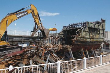 Demolition crews dismantle the Santa Maria at the Corpus Christi Museum of Science and History in August 2014.