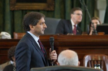 State Sen. Kevin Eltife answers questions from State Sen. Rodney Ellis, while Lt. Gov. Dan Patrick listens intently.