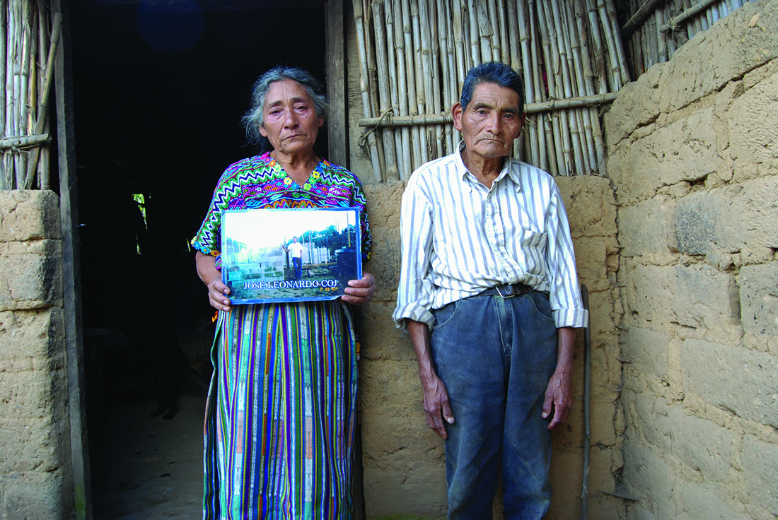 Cristina and Raymundo Coj Cumar with a photo of their son Jose Leonardo.