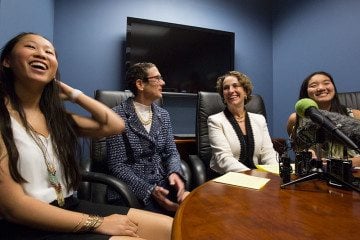 Sarah Goodfriend (center left) and her wife, Suzanne Bryant with their daughters, Dawn (left) and Ting (right) hold a press conference hours after becoming the first same-sex couple to legally marry in Texas. 