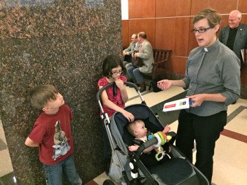 The Rev. Carolyn Albert Donovan, of St. Martins Lutheran Church in Austin, waits with her children to testify against House Bill 1745 on Wednesday.