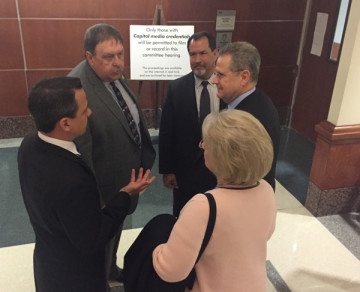 Texas Values President Jonathan Saenz, clockwise from left, Rep. Cecil Bell, Texas Pastor Council Executive Director Dave Welch, Rep. Rick Miller and his wife, Babs Miller, confer after Wednesday's committee hearing.