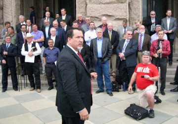 Dave Welch, executive director of the U.S. Pastor Council, addresses a group of pastors on the north steps of the Capitol Wednesday.