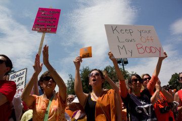 The battle over Texas' omnibus anti-abortion law began at the Texas Capitol in the summer of 2013, when pro-choice protesters wore orange to oppose the new restrictions.