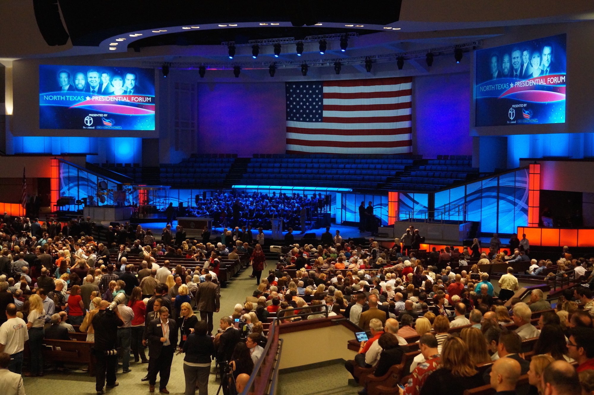 A huge American flag hangs behind the stage of a Plano megachurch.