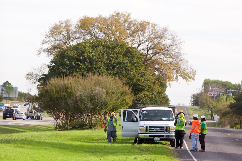 A Liberty Proclaimed Ministry clean-up crew works on the shoulder of Interstate 35 south of Fort Worth.