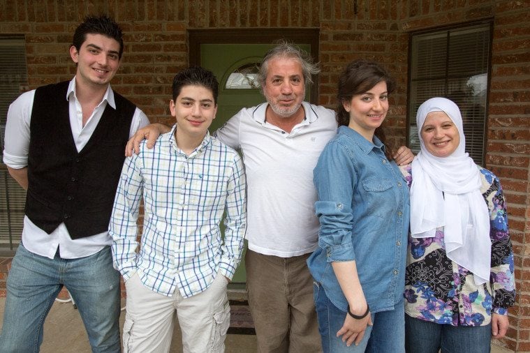 Iyad Al-Afandi (center), with his wife Lina (far right), daughter Noor and sons Nawar (far left) and Homam at their house in North Texas.